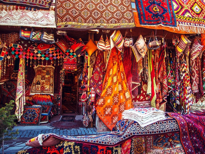 Traditional Anatolian kilims and carpets displayed in a Cappadocia shop