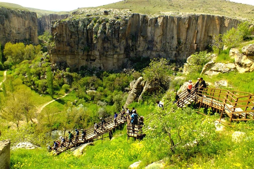 Ihlara Valley hiking trail along the Melendiz River with canyon walls and greenery
