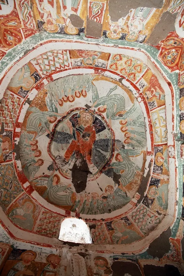 Frescoes inside Hidden Church with red geometric and biblical motifs