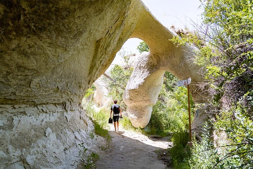 Zemi Valley hiking trail along Zemi Stream with shaded paths and rock tunnels