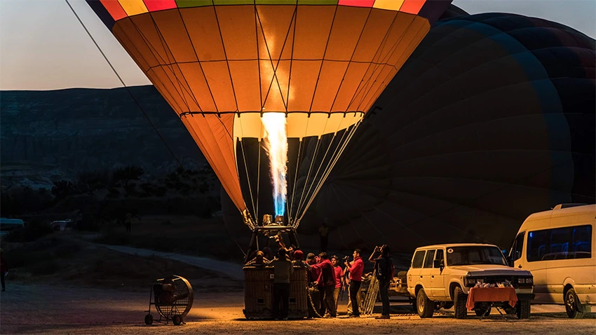 Cappadocia overview with balloons, valleys and rock formations
