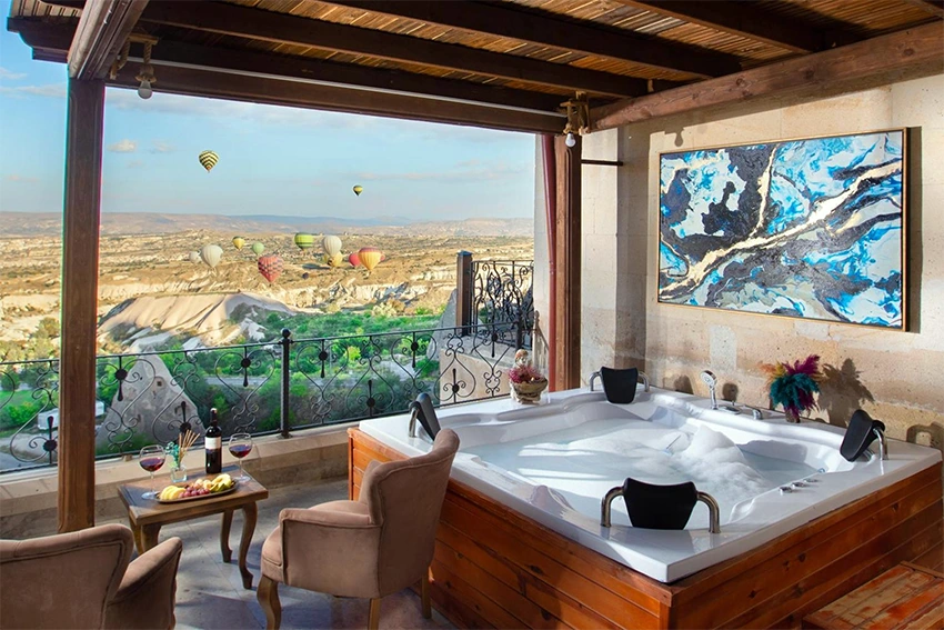 Fine dining terrace overlooking Cappadocia valleys with wine pairing