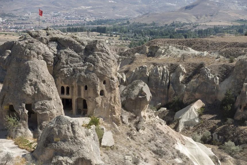 Rock-cut entrance of Pancarlık Church in the volcanic cliffs of Cappadocia