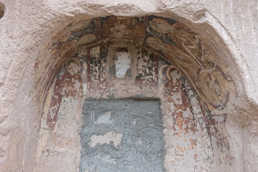 Rock-cut rooms and church entrance at Ayvalı complex in Rose Valley
