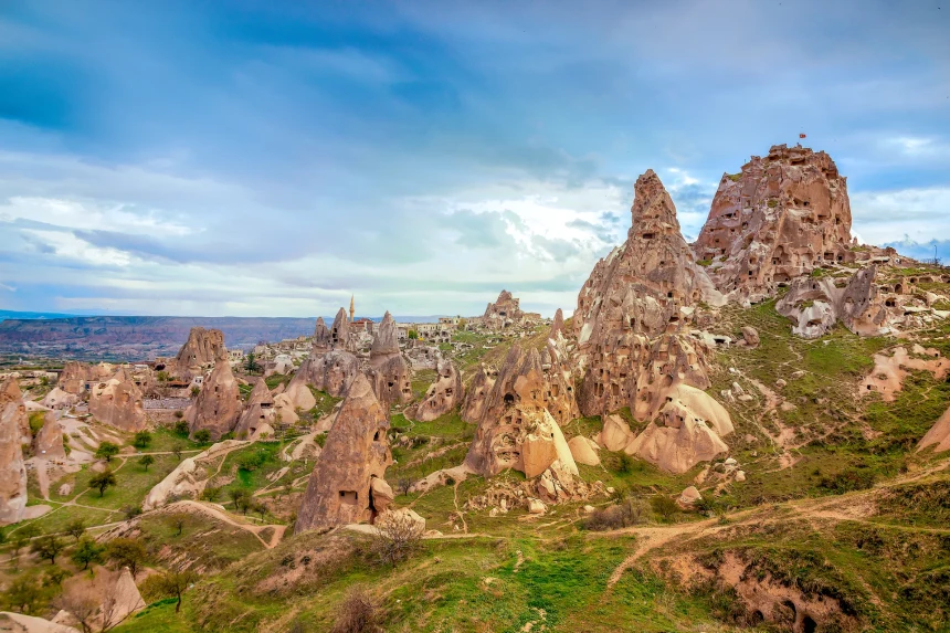 Daytime exterior view of Uçhisar Castle rising above the old village